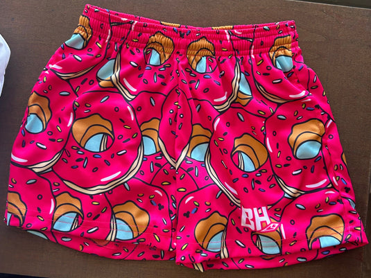 Double the donuts, double the style. Bright pink and sprinkled with sweetness, these shorts are the perfect pick for the player who brings the sugar and the spice.